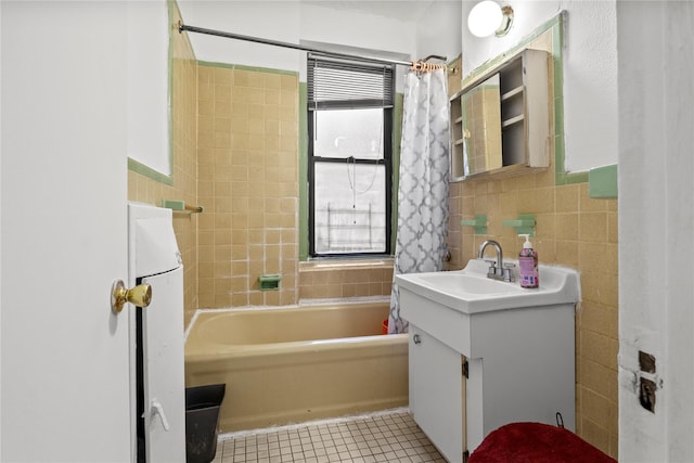 bathroom featuring vanity, backsplash, tile patterned floors, tile walls, and shower / tub combo with curtain