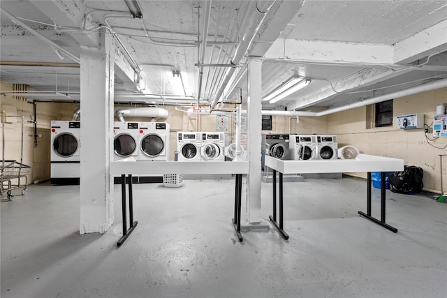 basement with washer and clothes dryer