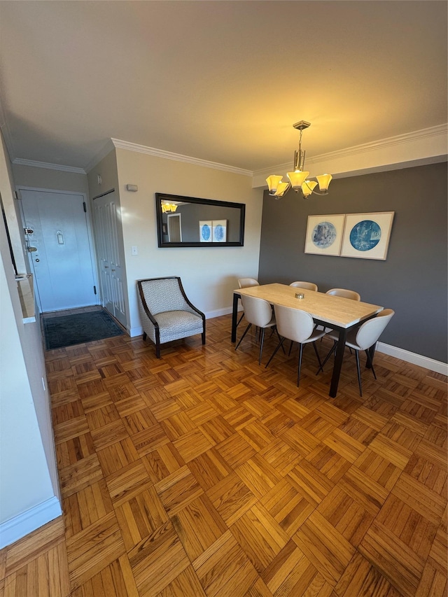 dining room featuring a notable chandelier, parquet floors, and ornamental molding