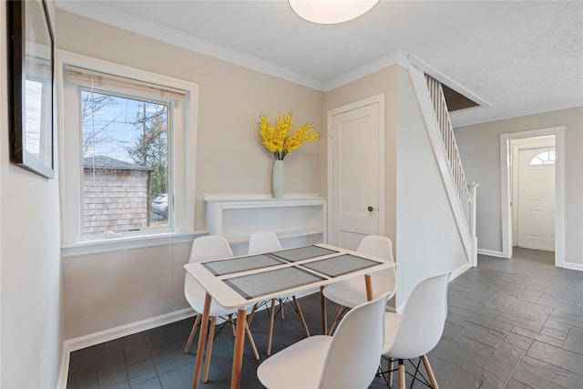 dining room featuring ornamental molding