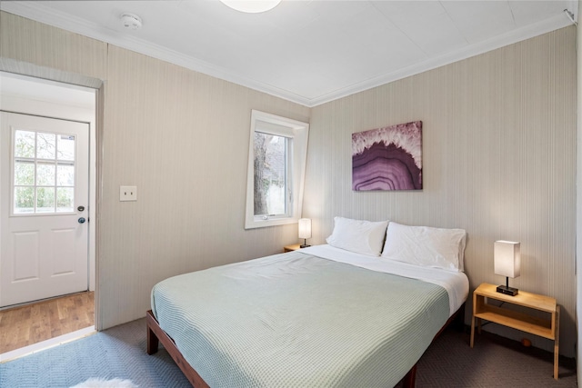 bedroom with crown molding and wood-type flooring