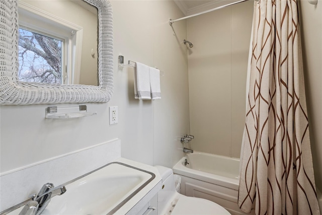 full bathroom featuring sink, shower / tub combo, and toilet