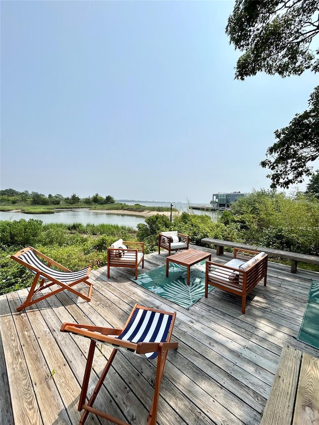 wooden terrace with a water view