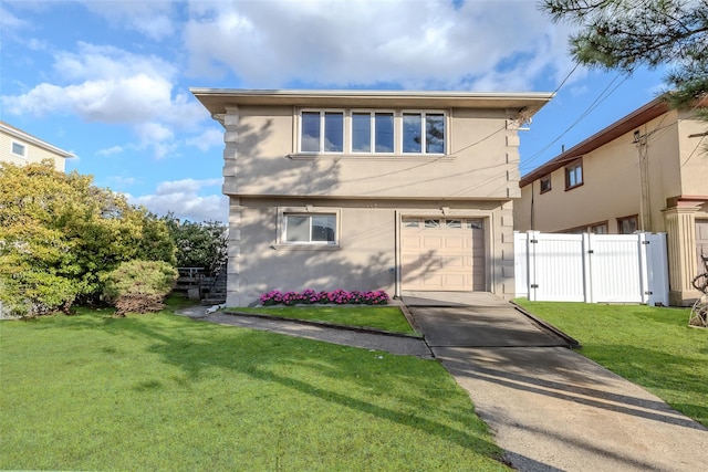 883 S Long Beach Ave, Freeport, NY 11520 - view of front of home featuring a front lawn and a garage
