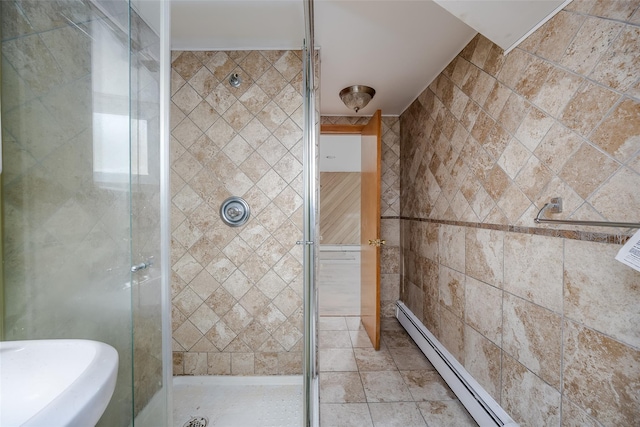 883 S Long Beach Ave, Freeport, NY 11520 - bathroom with a shower with shower door, tile walls, and a baseboard radiator