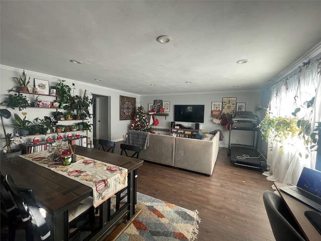 dining room with hardwood / wood-style floors and ornamental molding