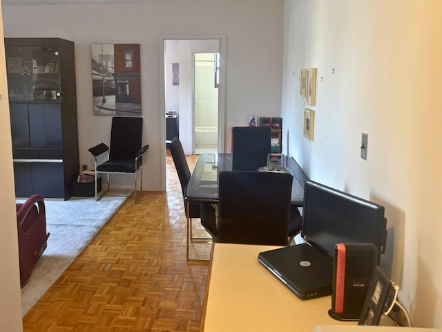 home office featuring parquet flooring