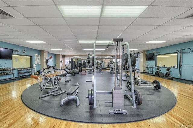 gym with wood-type flooring