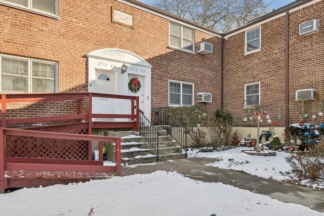 view of snow covered property entrance