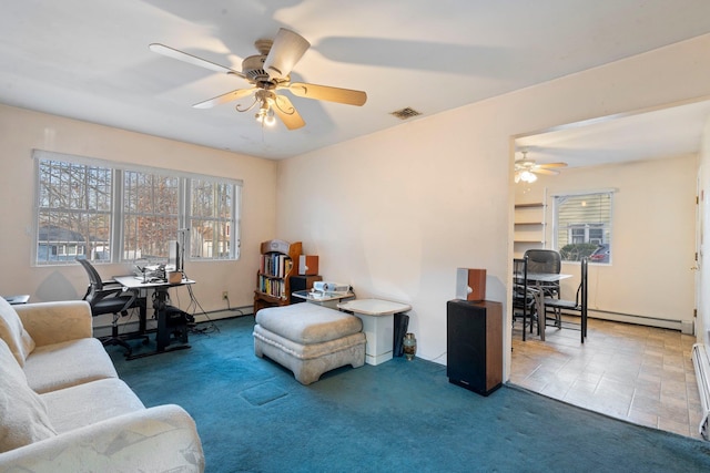 interior space with carpet floors, baseboard heating, a healthy amount of sunlight, and ceiling fan