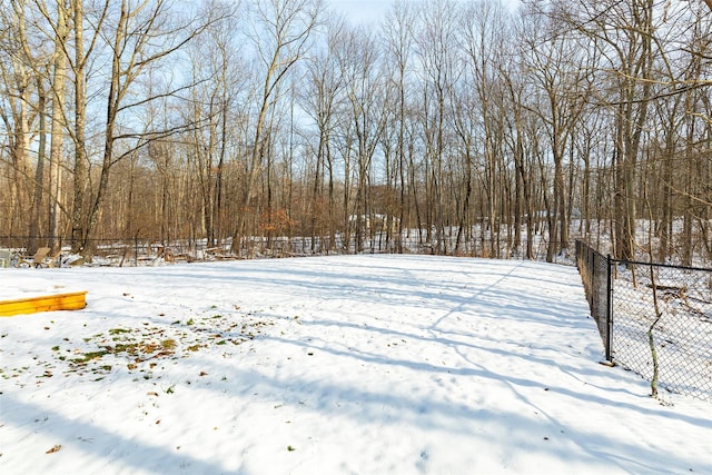 view of yard layered in snow