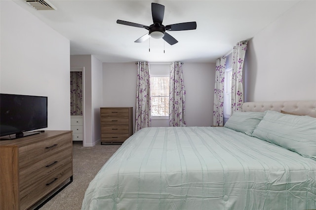 bedroom featuring ceiling fan and light colored carpet