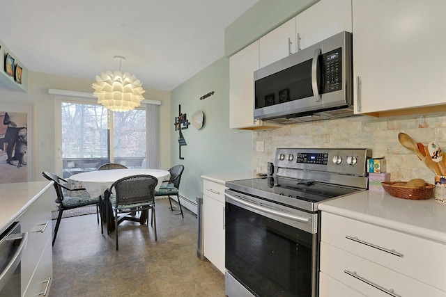 kitchen with white cabinets, hanging light fixtures, decorative backsplash, a notable chandelier, and stainless steel appliances