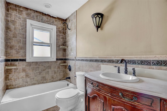 full bathroom featuring toilet, vanity, tile walls, and tiled shower / bath