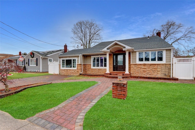 ranch-style home featuring a front yard