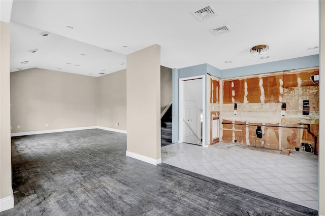 unfurnished living room with light tile patterned flooring