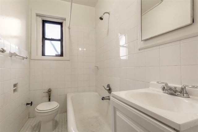 full bathroom with vanity, tile walls, and toilet