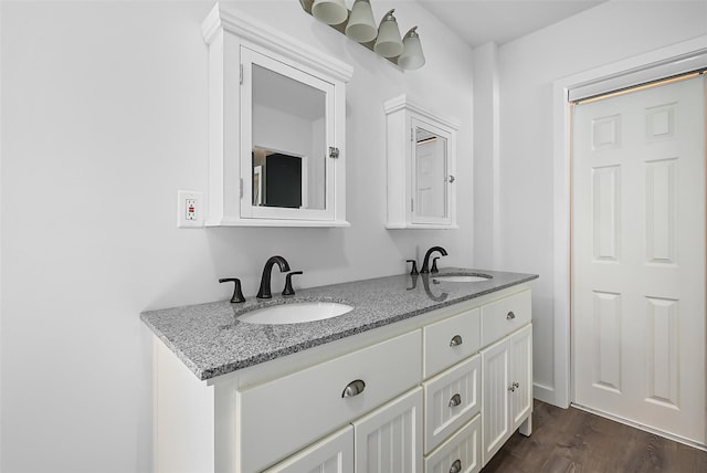 bathroom featuring hardwood / wood-style floors and vanity