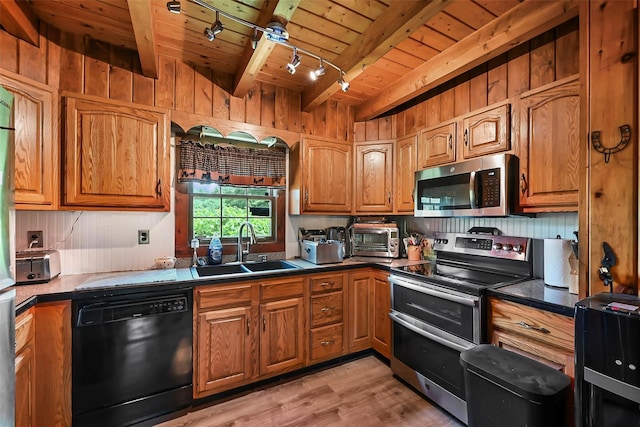 kitchen featuring wooden ceiling, sink, light wood-type flooring, appliances with stainless steel finishes, and beamed ceiling