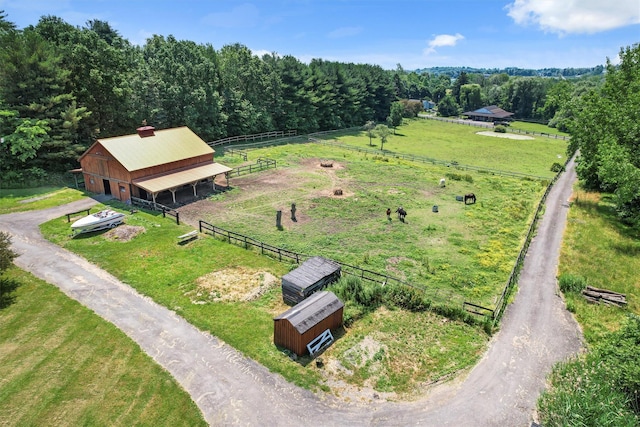 birds eye view of property featuring a rural view