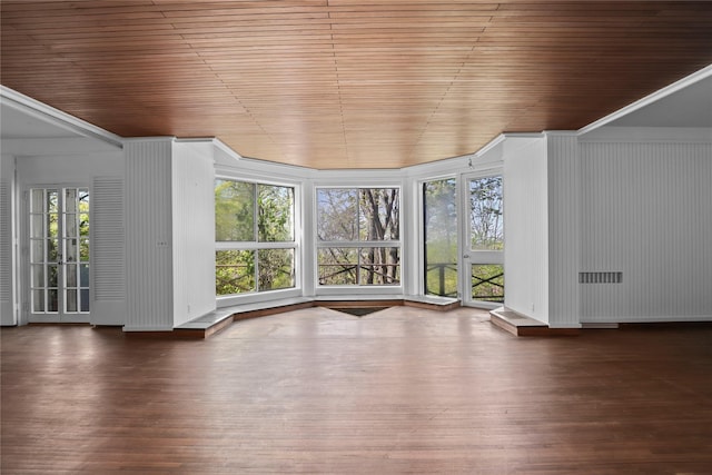 unfurnished living room featuring wooden ceiling, radiator heating unit, and dark hardwood / wood-style floors