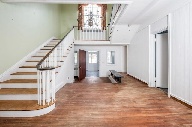 foyer featuring radiator heating unit and wood-type flooring