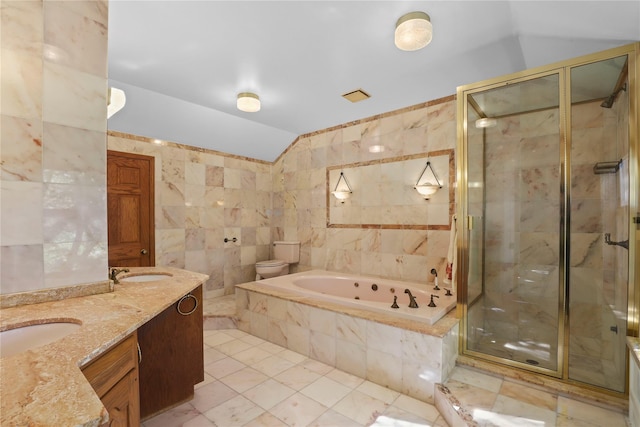 full bathroom featuring tile walls, independent shower and bath, and toilet