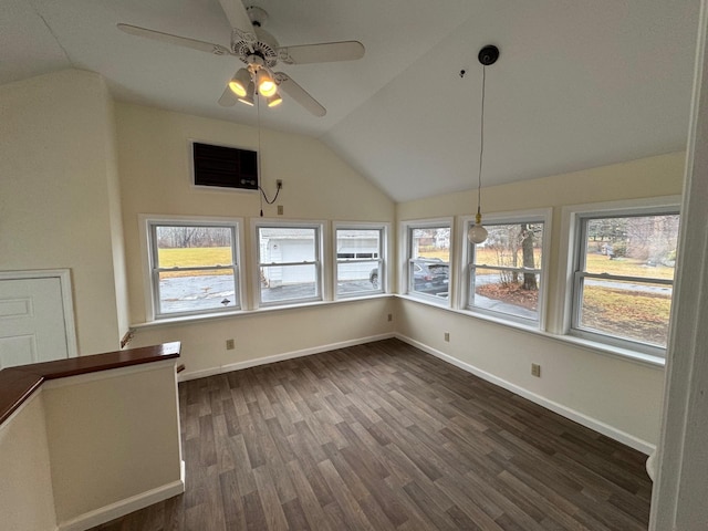 interior space with vaulted ceiling, ceiling fan, and dark wood-type flooring