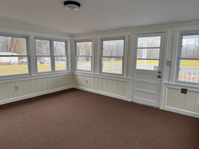 unfurnished sunroom with plenty of natural light and vaulted ceiling