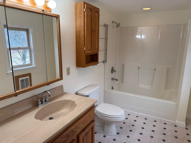 full bathroom with vanity, washtub / shower combination, and toilet