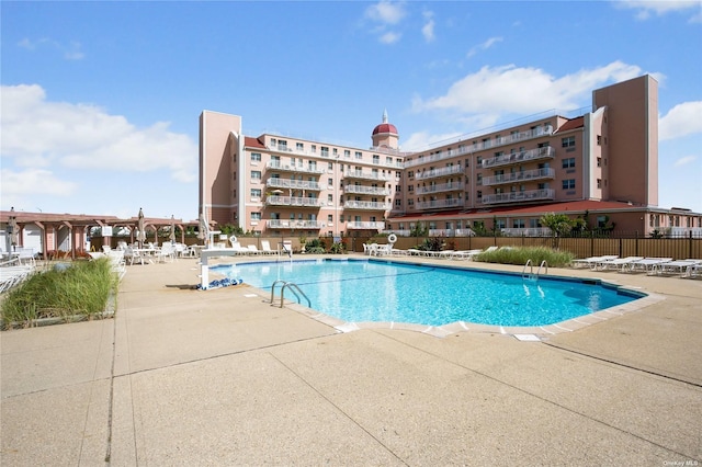 view of pool featuring a patio area