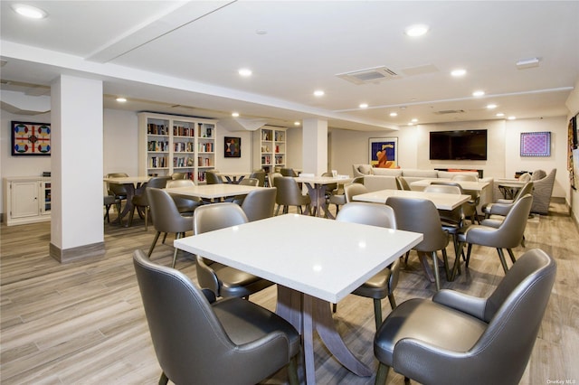 dining area with light hardwood / wood-style flooring