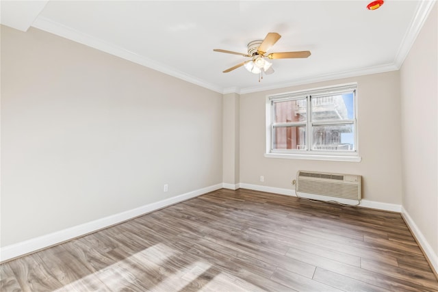 spare room with a wall mounted AC, ceiling fan, ornamental molding, and hardwood / wood-style flooring