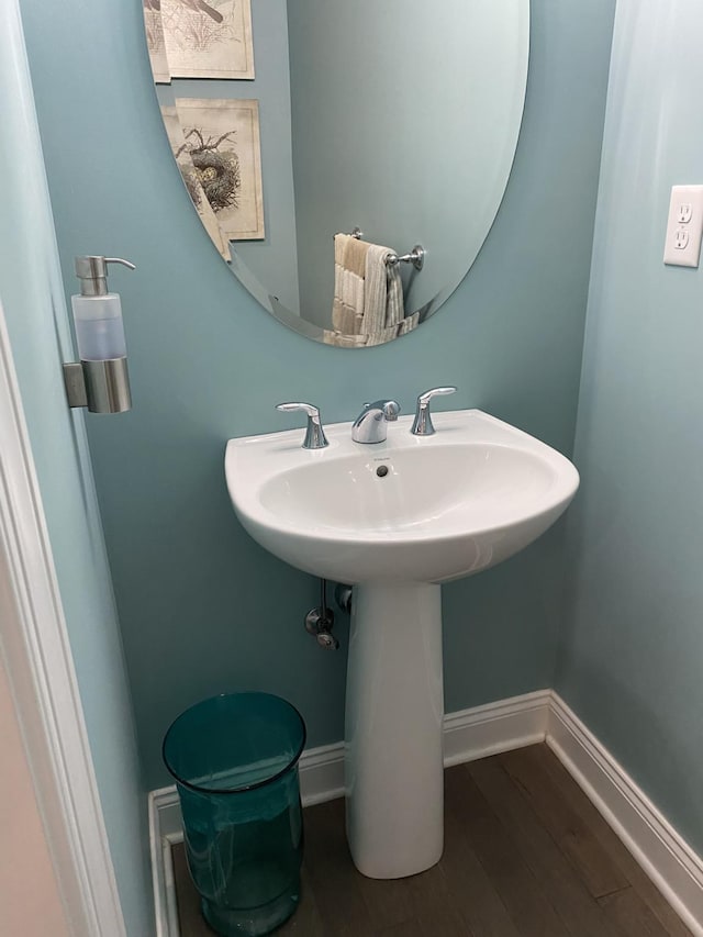 bathroom with hardwood / wood-style floors