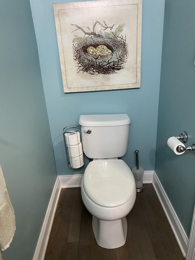 bathroom featuring wood-type flooring and toilet