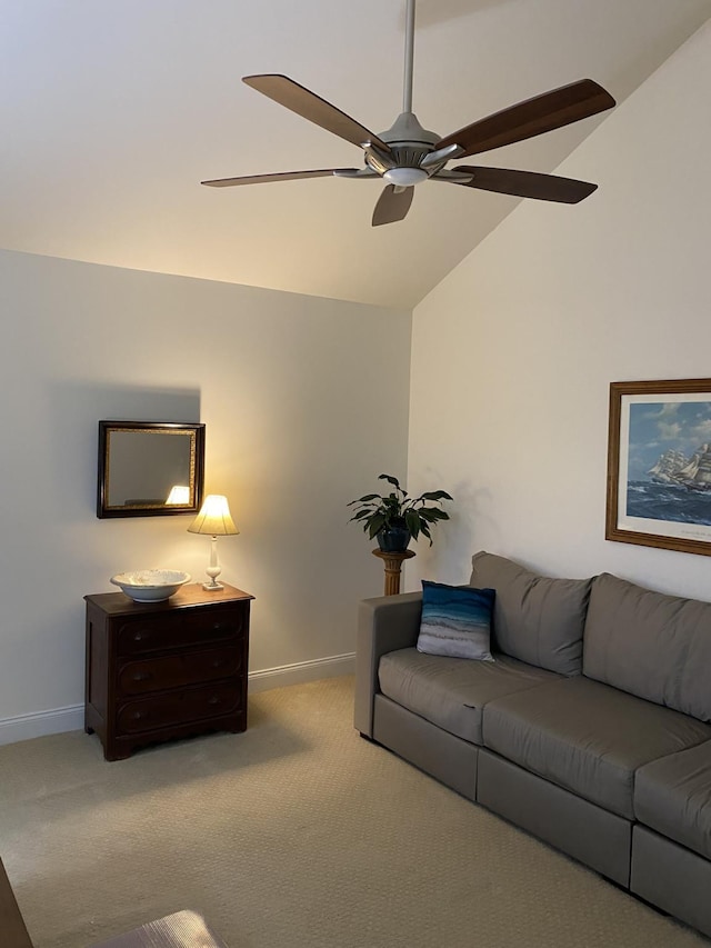 carpeted living room featuring ceiling fan and lofted ceiling