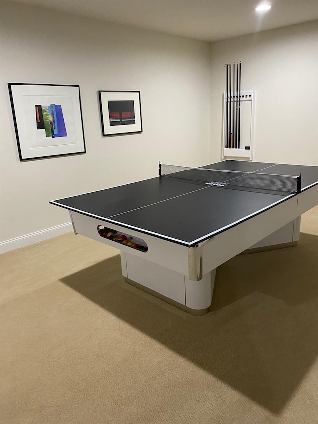 recreation room featuring light colored carpet