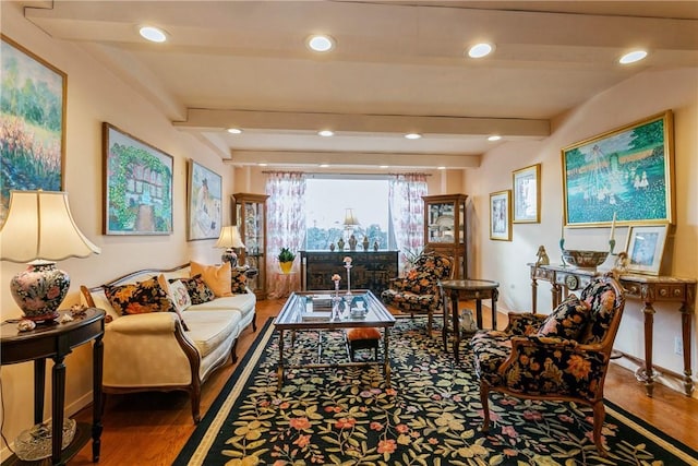 living room with beamed ceiling and hardwood / wood-style floors