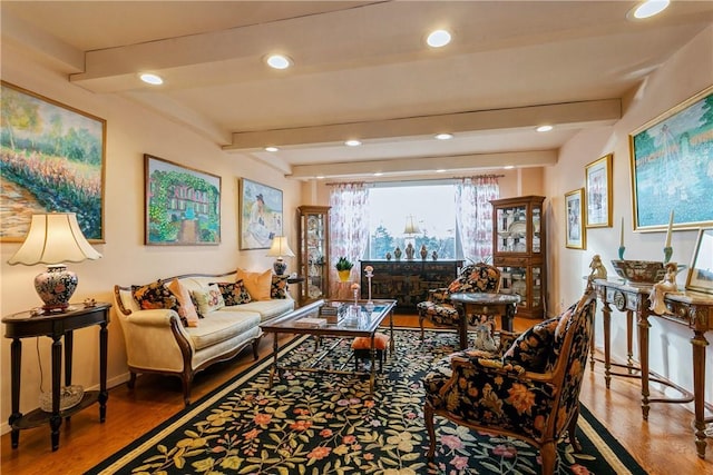 living room with beam ceiling and wood-type flooring