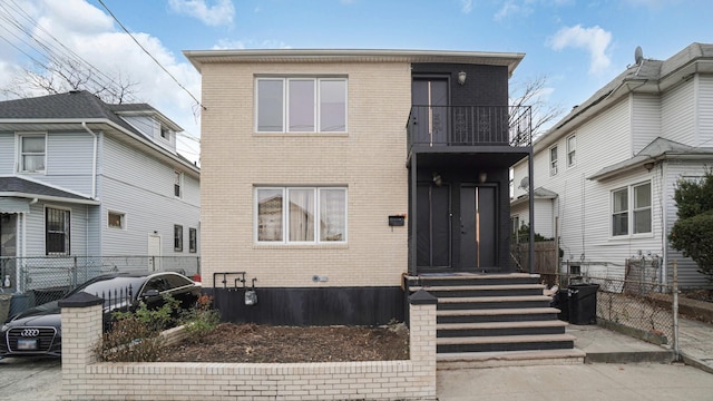 front of property featuring a balcony