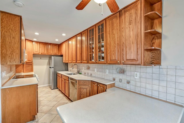 kitchen with ceiling fan, sink, stainless steel appliances, tasteful backsplash, and light tile patterned flooring