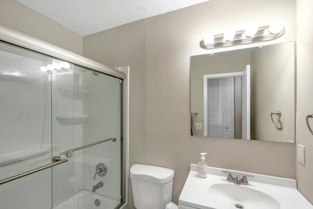 full bathroom featuring vanity, toilet, and enclosed tub / shower combo