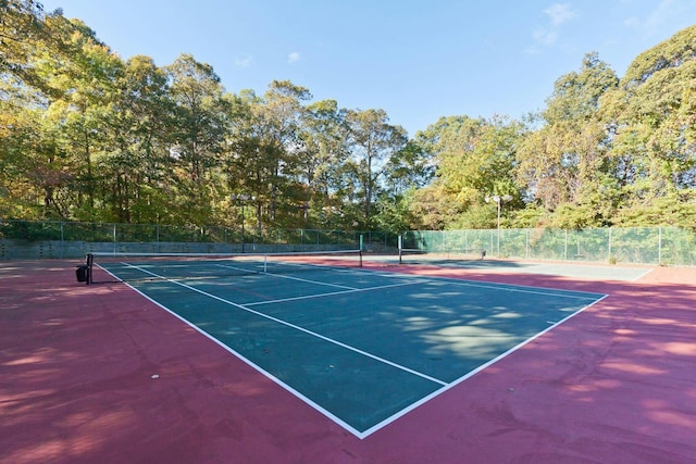 view of sport court with basketball hoop