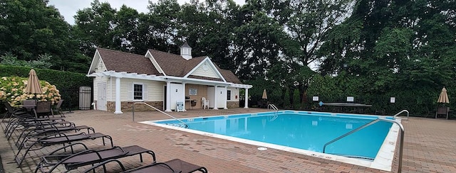 view of pool featuring a patio area