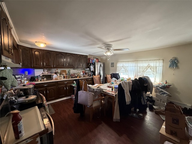 kitchen with stainless steel refrigerator, ceiling fan, dark brown cabinetry, and dark hardwood / wood-style flooring