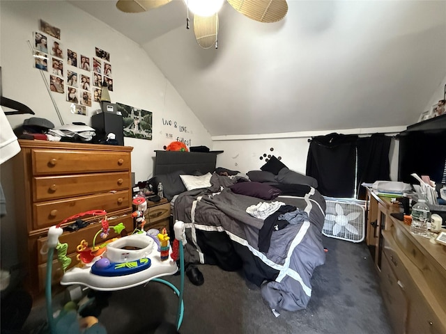 bedroom with ceiling fan, dark carpet, and lofted ceiling