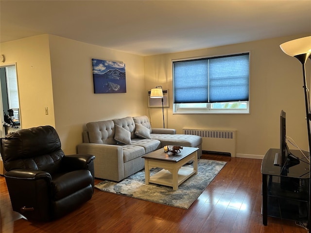 living room featuring radiator and dark wood-type flooring