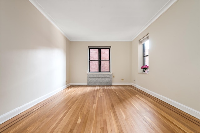 unfurnished room with crown molding and hardwood / wood-style floors