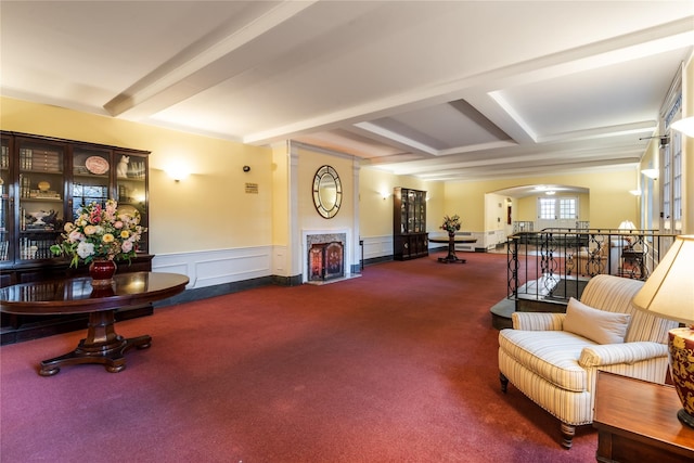 interior space featuring beamed ceiling and carpet floors