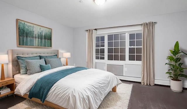 bedroom featuring dark hardwood / wood-style flooring